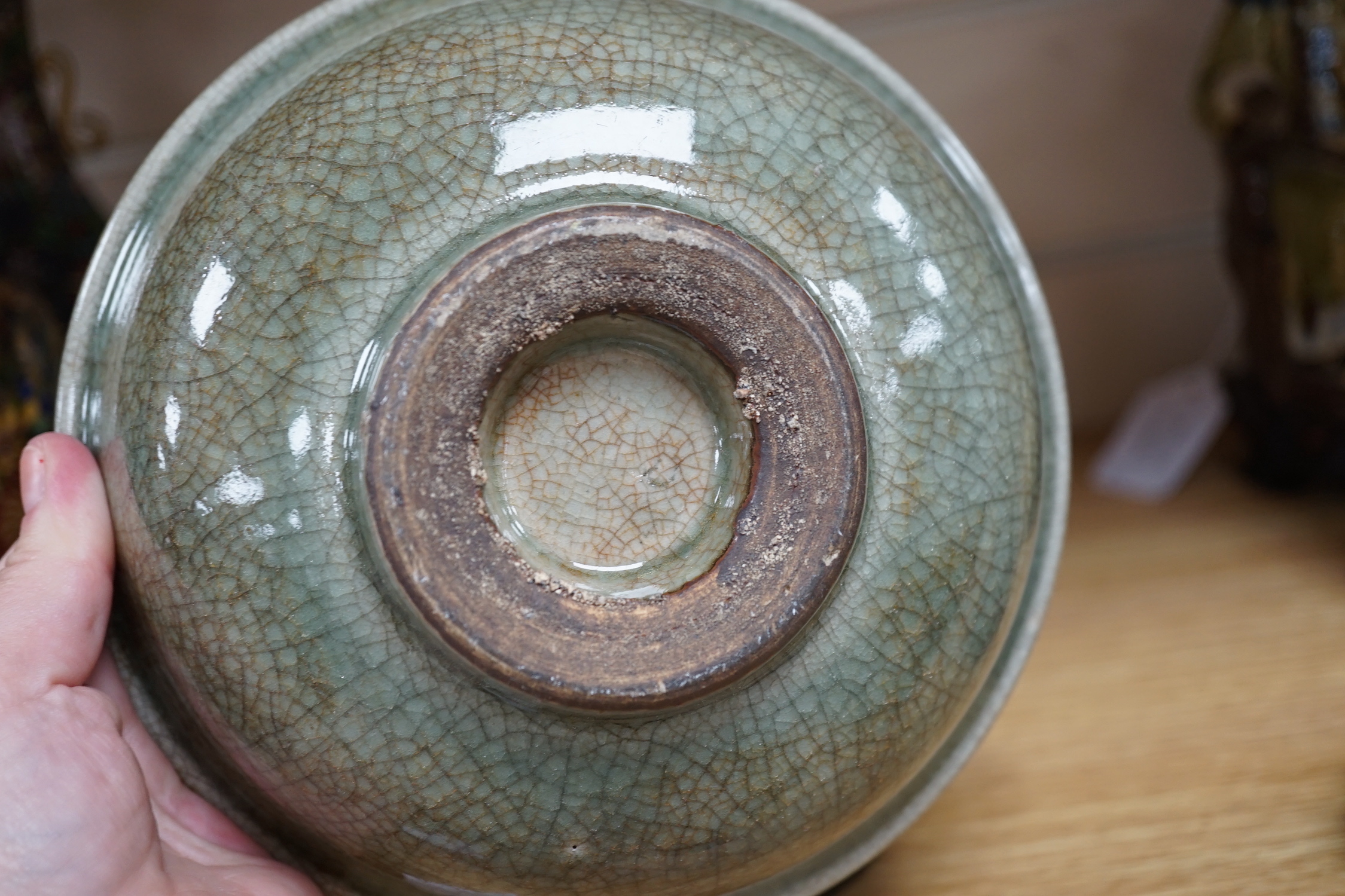 A Chinese Guan type green crackle glaze bowl, early 20th century 19cm diameter, on hardwood stand